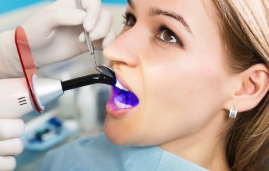 Dental patient receiving cosmetic dental bonding