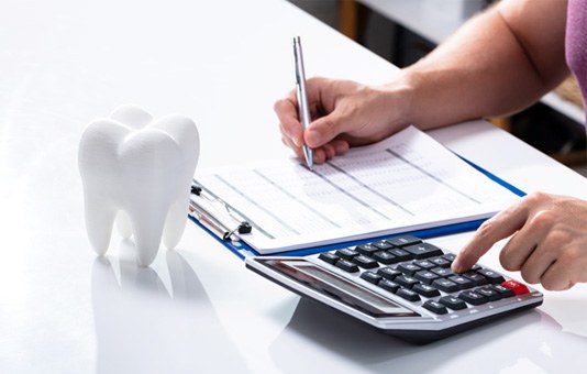 Patient in Garland budgeting for dentures