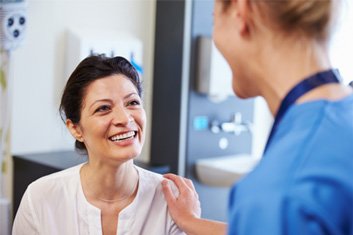 Patient in Garland talking to dentist about dental implants