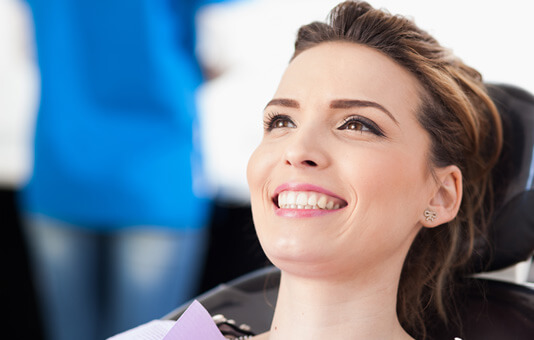 woman smiling in dental chair