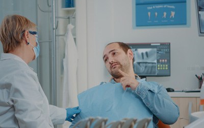 concerned man at dental exam  