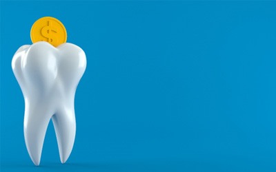 A giant tooth and a coin, objects that symbolize the cost of dental implants in Garland
