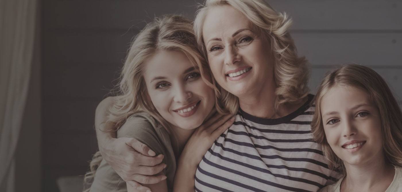 Three generations of women smiling