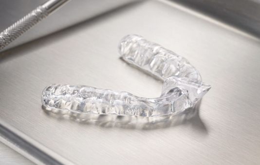 Clear nightguard for bruxism on metal tray