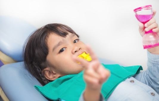 Child receiving fluoride treatment