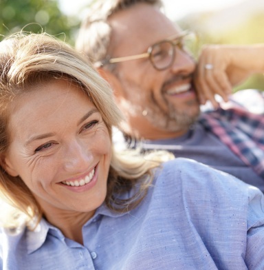 Man and woman with healthy smiles after preventive dentistry