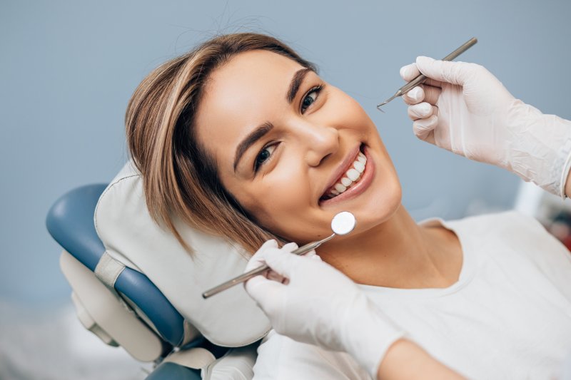 Smiling young woman having a dental checkup
