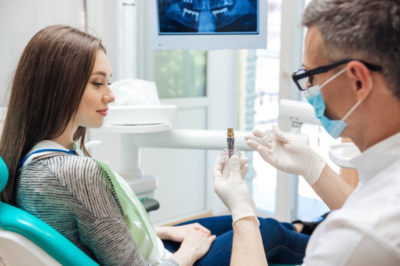 A dentist and his patient talking at their cosmetic dentistry consultation