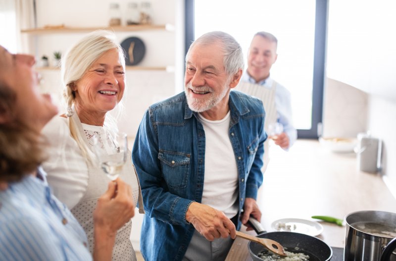 Patient with dentures talking to family