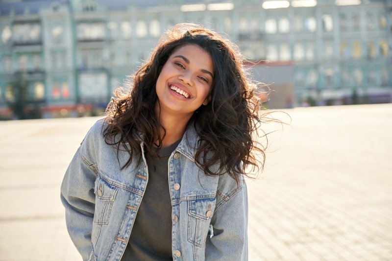 Lady smiles outdoors